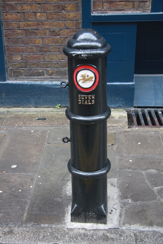Photograph of bespoke Seven Dials bollard with Golden Hind motif