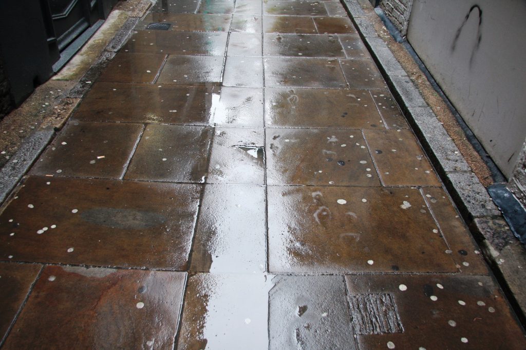 Photograph of central limestone drainage channel in Tower Court