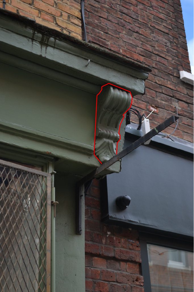 A bracket highlighted on a shopfront on Earlham Street